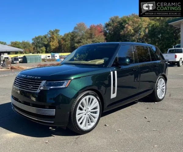 dark metallic green Range Rover SUV parked outdoors in a paved lot, showcasing paint protection film in Ellington CT